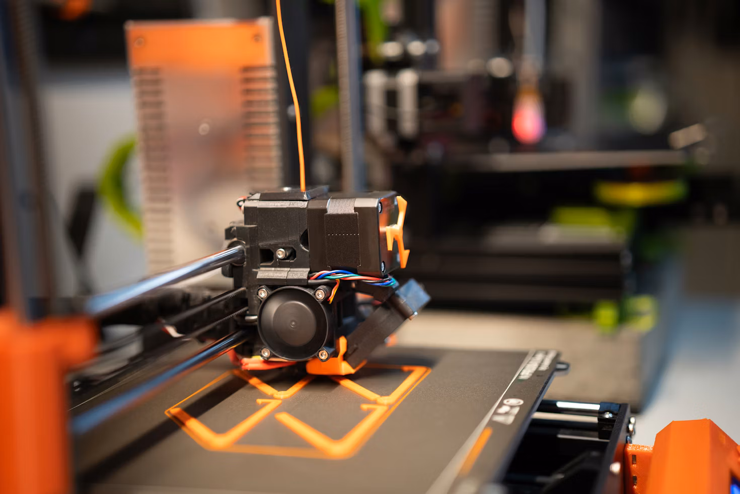 A collection of precision robotic components and accessories on a workbench.